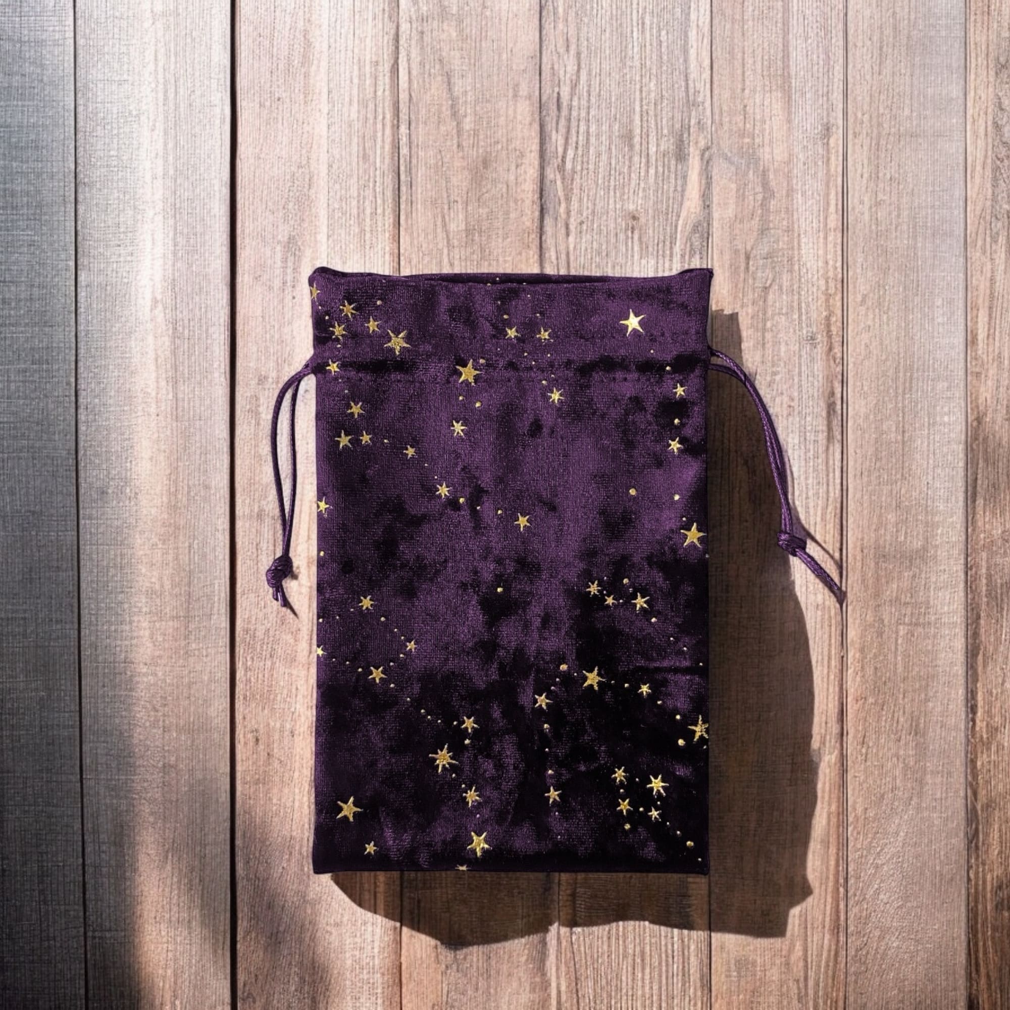 Celestial velvet tarot bag with golden stars for storing tarot decks, pendulums, or crystals. Perfect for Wiccan supplies, Pagan rituals, and spiritual protection on the go.