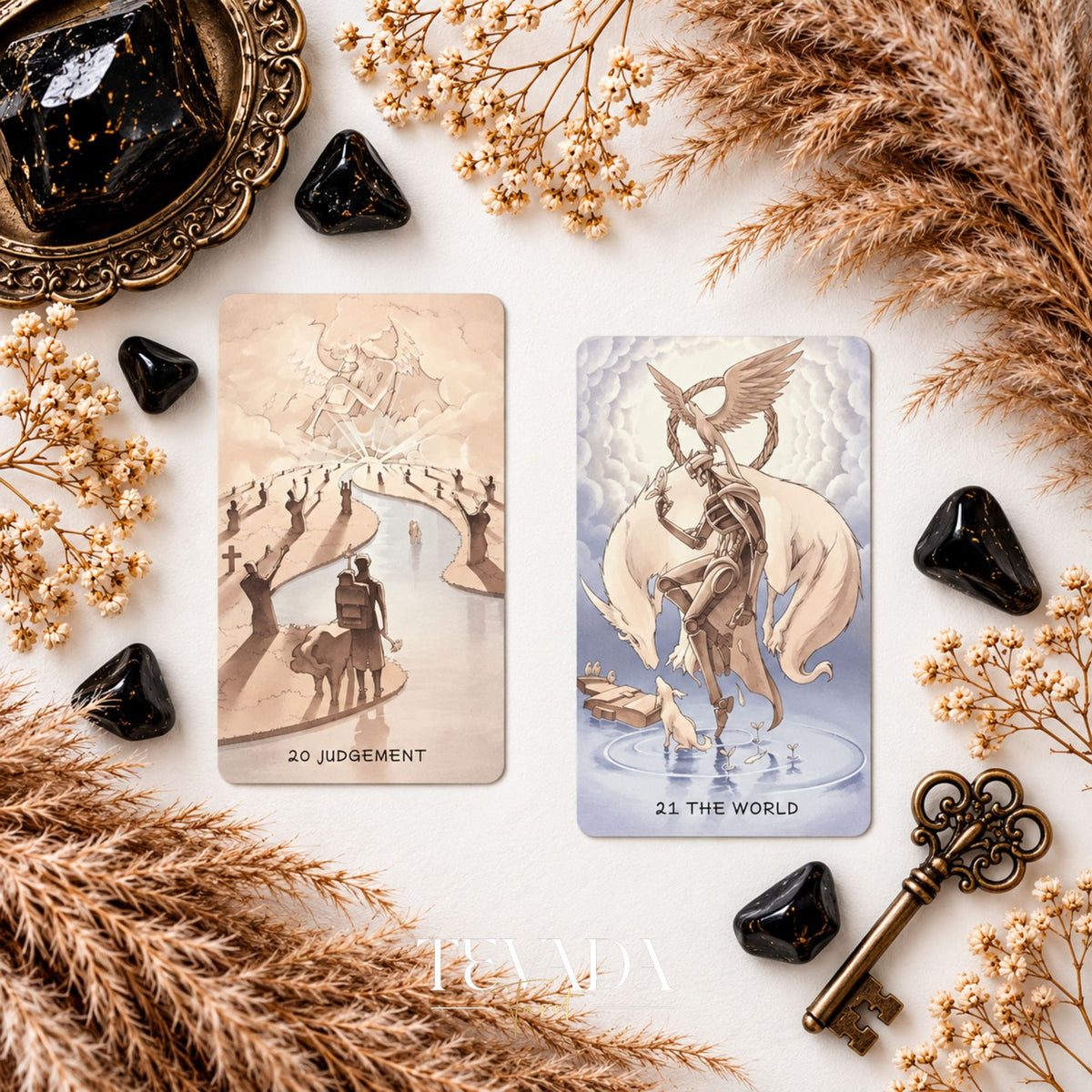 Ethereal Poetry Tarot Deluxe Judgement and The World cards shown together among dried grasses and black crystals.