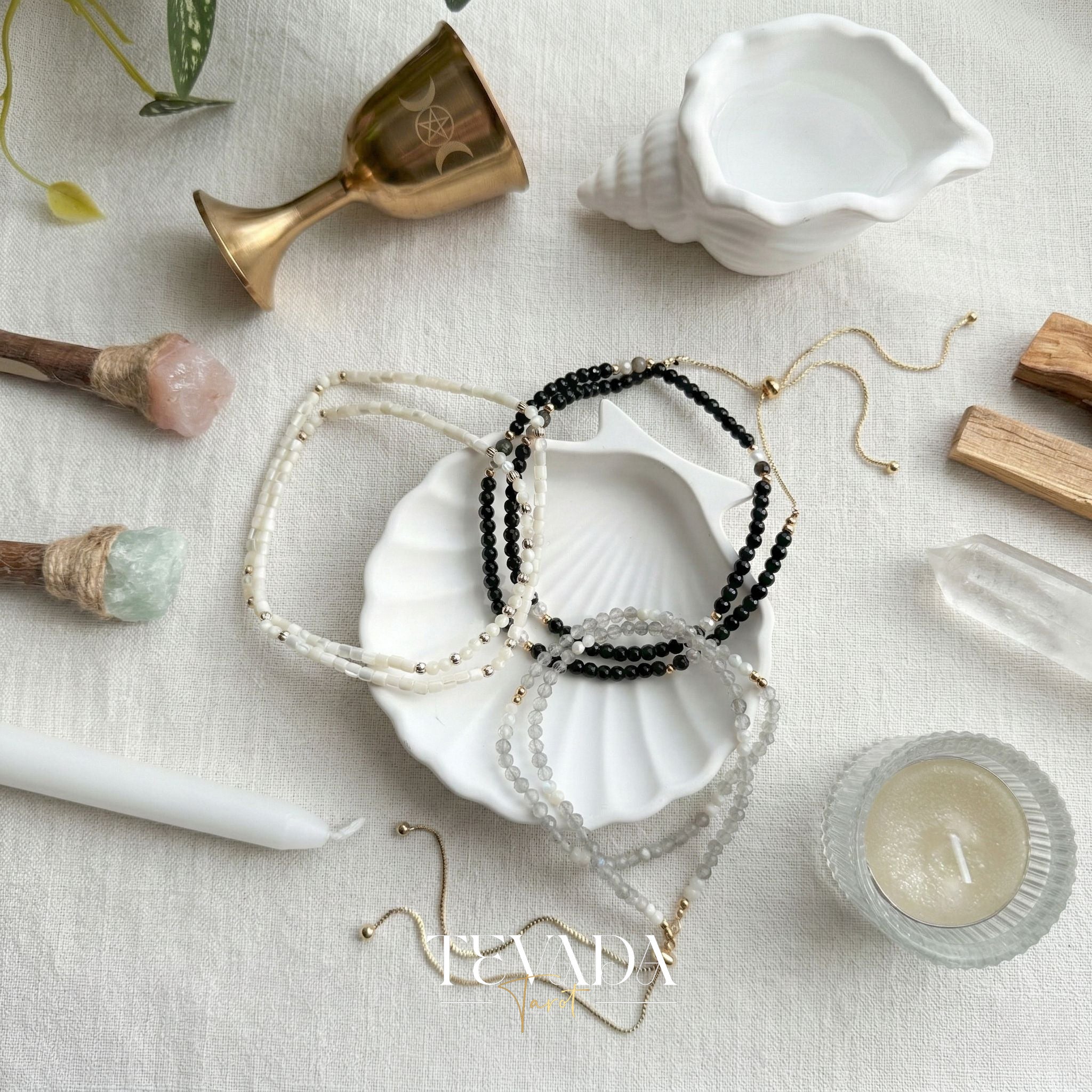 Hand-made Crystal Bracelet in Black Obsidian, Moonstone, and Shell Stone for grounding energy and daily spiritual practice.