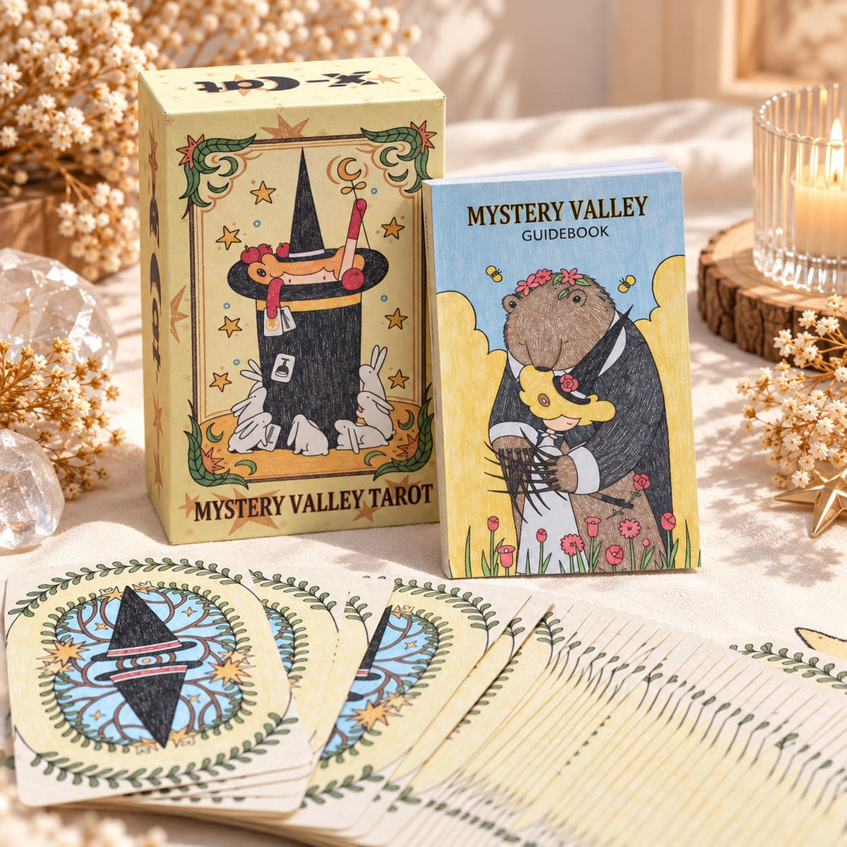 Mystery Valley Tarot DELUXE tarot card artwork with playful witches, storybook forests, and oversized fantasy creatures