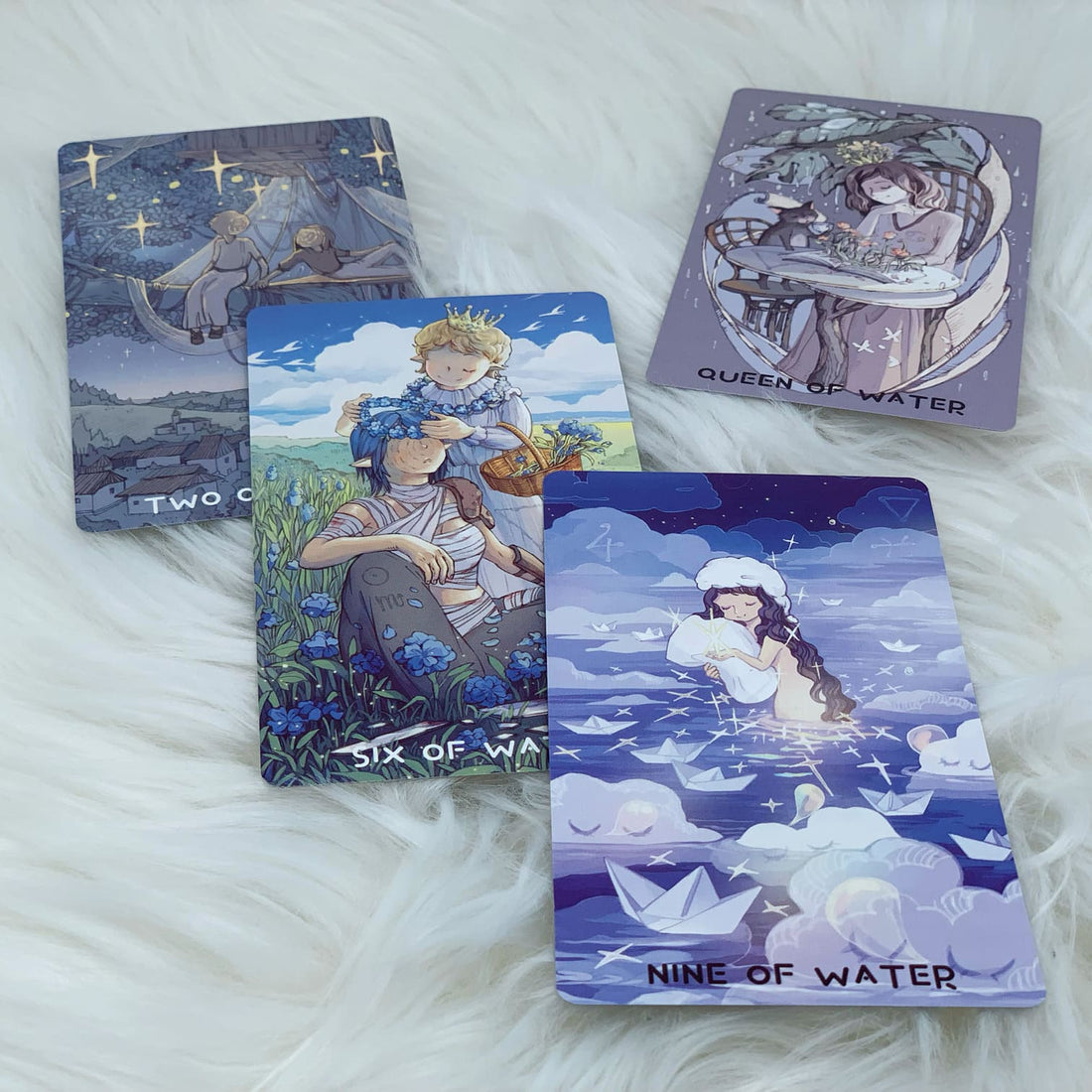 The deck consists of 22 Major Arcana & 56 Minor Arcana Cards, featuring Japanese-style illustrations of fairies and other magical creatures. It comes with a Guidebook with the descriptions and meanings of the cards.