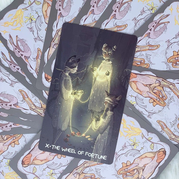The deck consists of 22 Major Arcana & 56 Minor Arcana Cards, featuring Japanese-style illustrations of fairies and other magical creatures. It comes with a Guidebook with the descriptions and meanings of the cards.