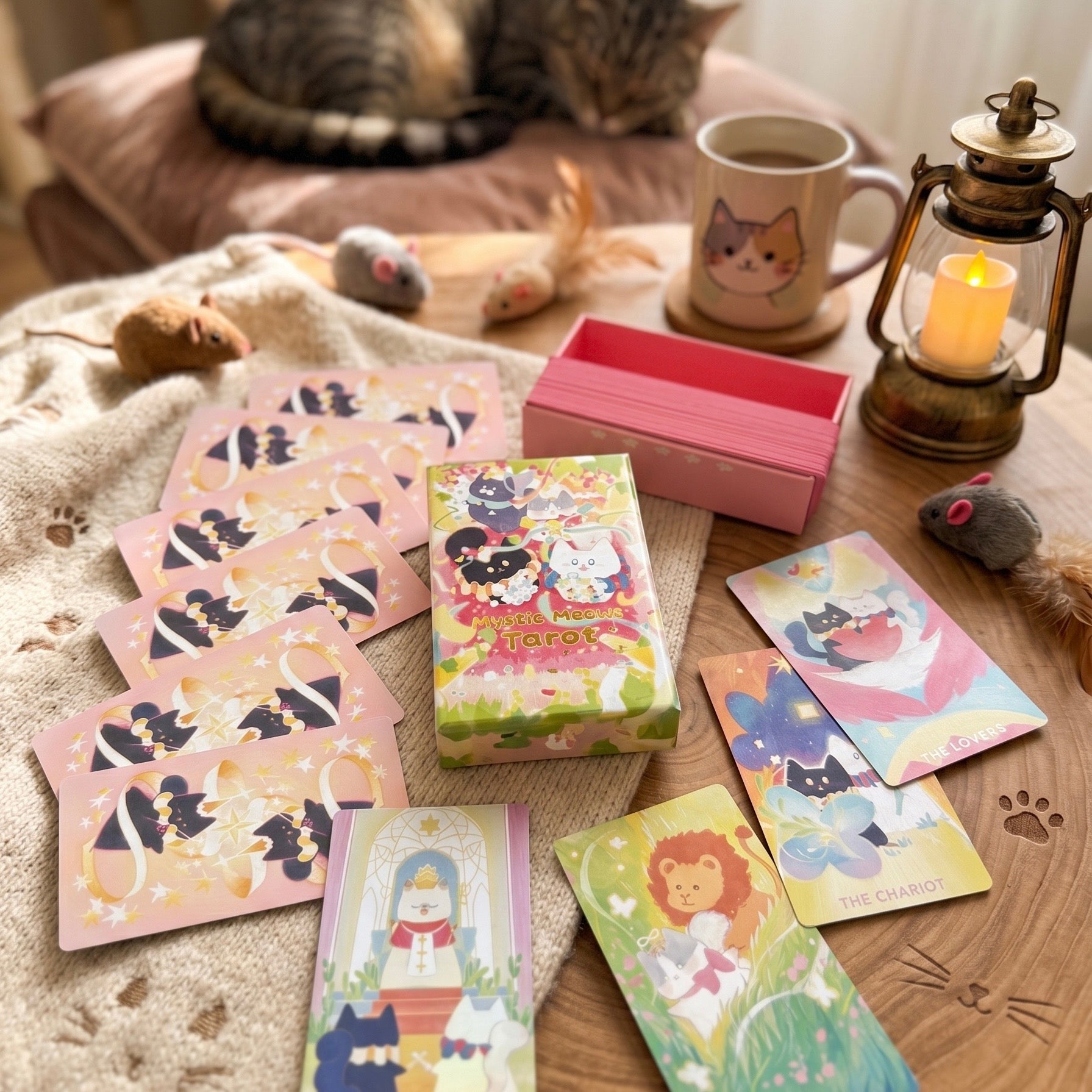 Mystic Meows Tarot PINK Deluxe deck featuring dreamy cat illustrations on premium 330gsm black core cards with blue splatter and silver sparkle edges, in a magnetic flip-top rigid box.