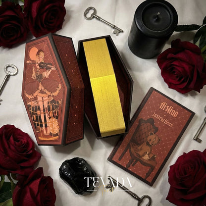 Aisling Tarot Gilded Edt featuring gothic violin art and coffin box for shadow work divination.