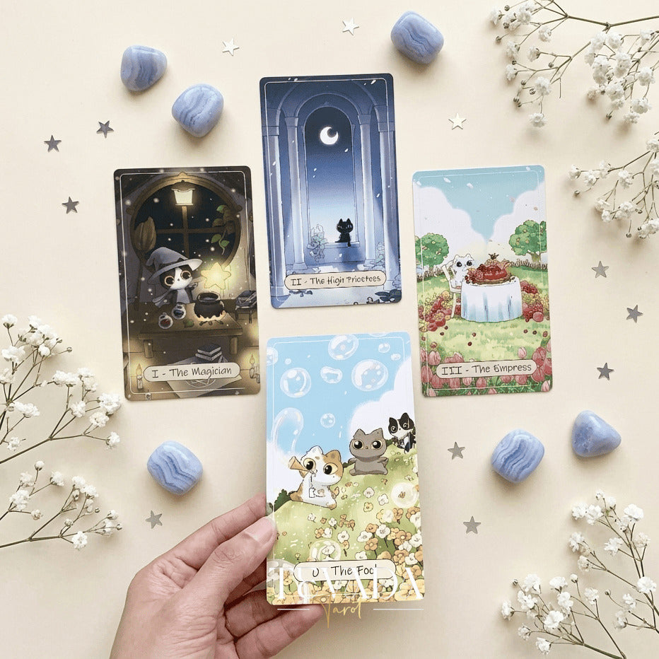 Catopia Tarot II featuring whimsical cat artwork on smooth cardstock for healing and playful divination.