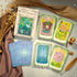 Discover Miranda’s Garden Tarot DELUXE—an intuitive, oil-painted deck inspired by a magical four-season garden. Perfect for soulful guidance, clarity, and heartfelt divination.