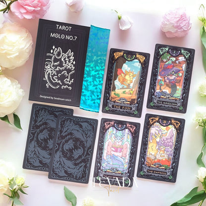 Discover the Molo No.7 Tarot Deck DELUXE Edition—78 cartoon-style cards featuring wolves and dragons, housed in a wooden box. A magical tool for divination, clarity, and intuitive readings.