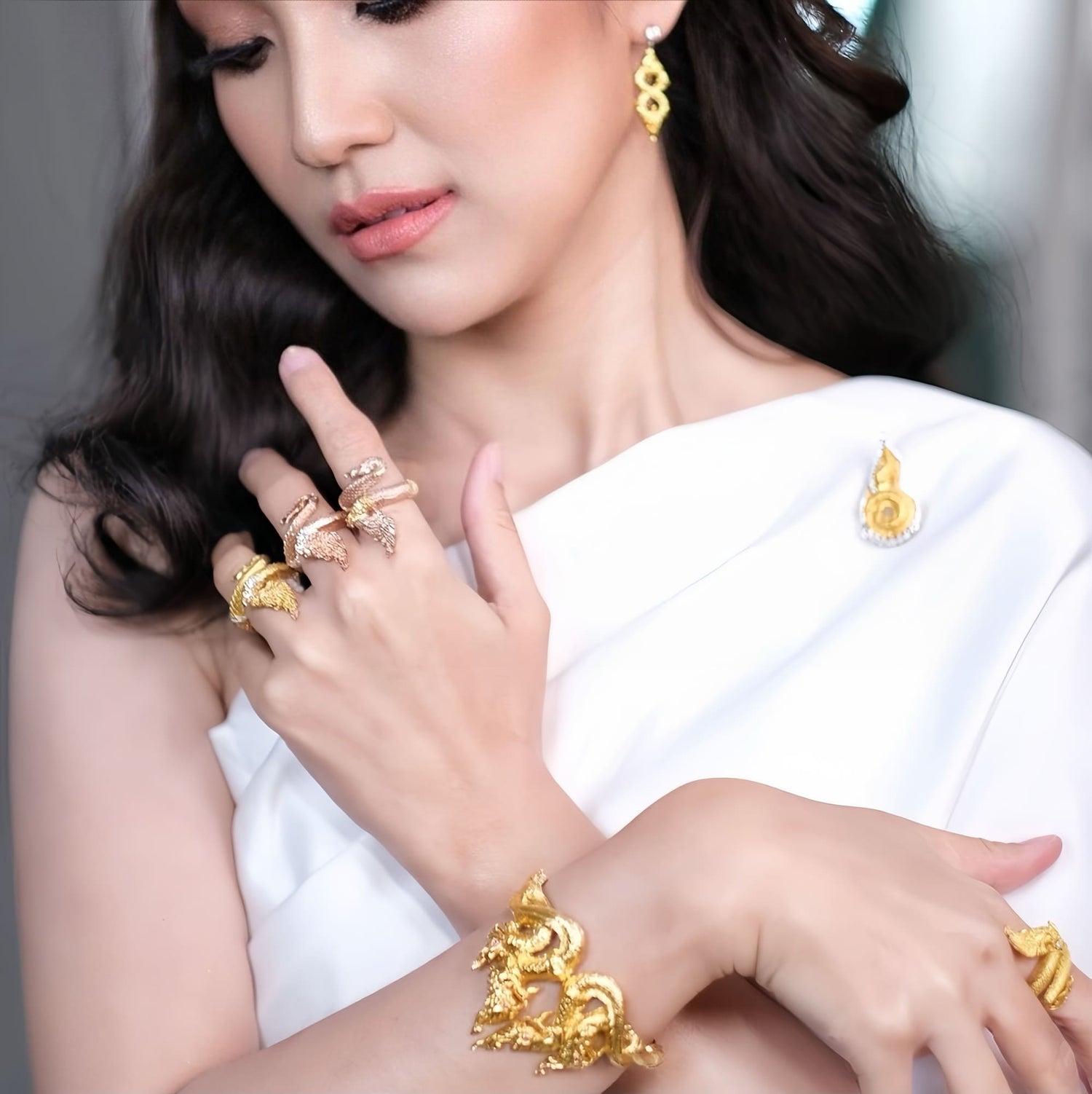 Discover the Naga Devine Dragon Charm Ring, a blend of Thai spirituality and elegance. Imbued with good luck and fortune, this 24K gold-plated amulet is a symbol of protection and prosperity. Embrace mystical charm!