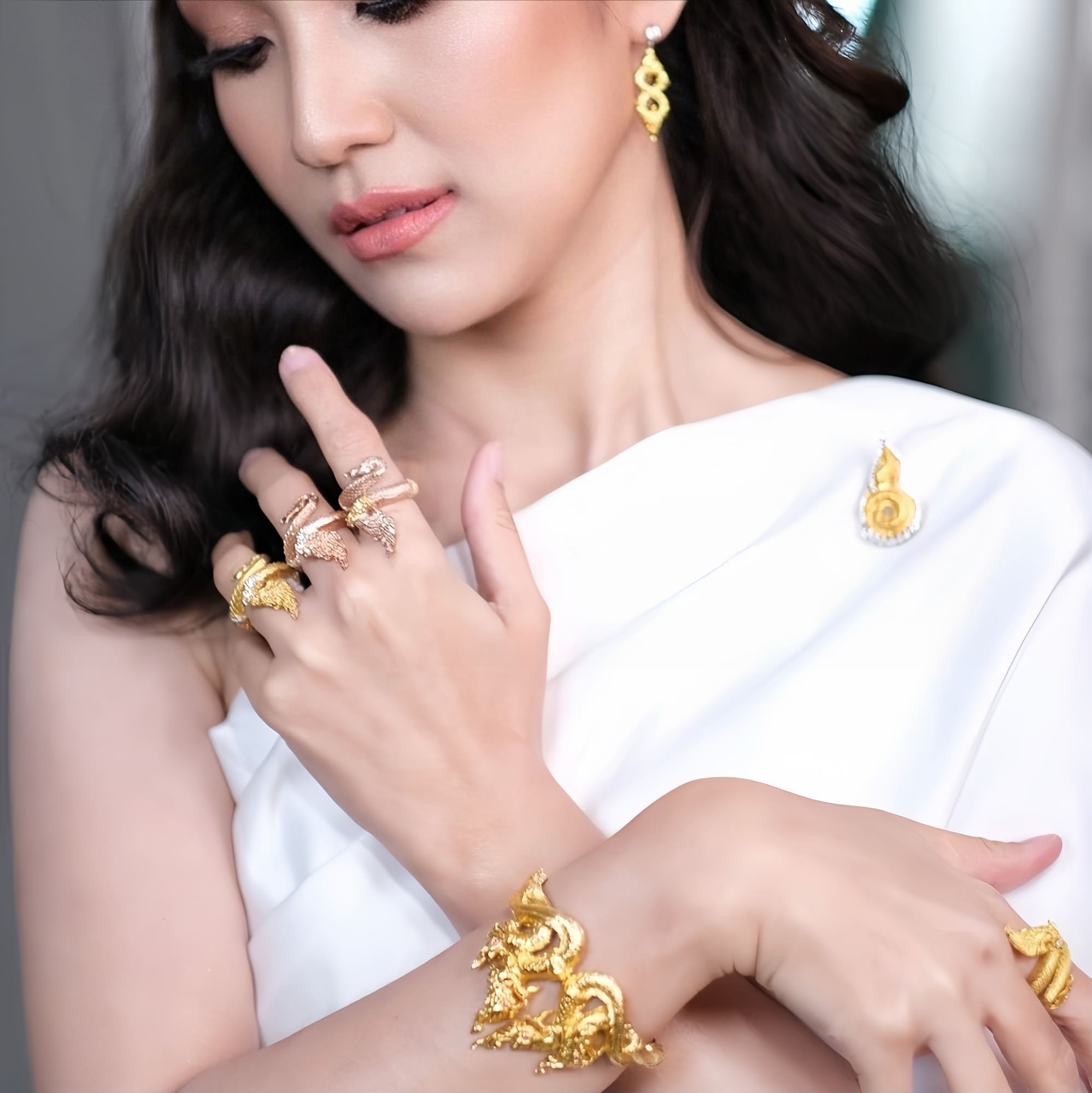 Discover the Naga Devine Dragon Charm Ring, a blend of Thai spirituality and elegance. Imbued with good luck and fortune, this 24K gold-plated amulet is a symbol of protection and prosperity. Embrace mystical charm!