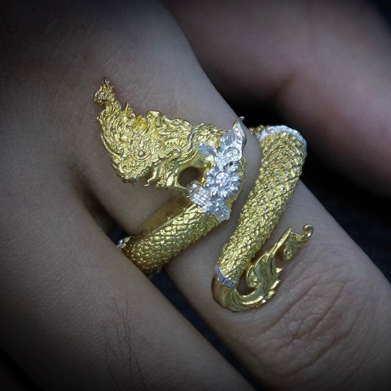 Discover the Naga Devine Dragon Charm Ring, a blend of Thai spirituality and elegance. Imbued with good luck and fortune, this 24K gold-plated amulet is a symbol of protection and prosperity. Embrace mystical charm!