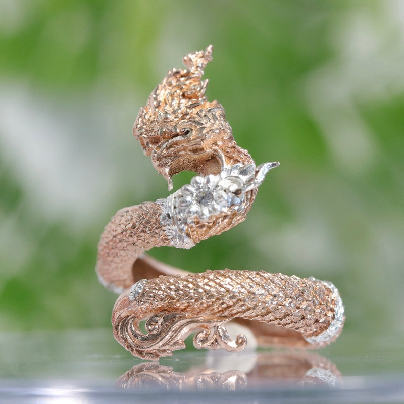 Unlock spiritual power with the Naga Devine Dragon Ring, rose gold-plated with sacred rituals by Ajarn Luck Ratchasi and Thai monks. A symbol of fortune and protection