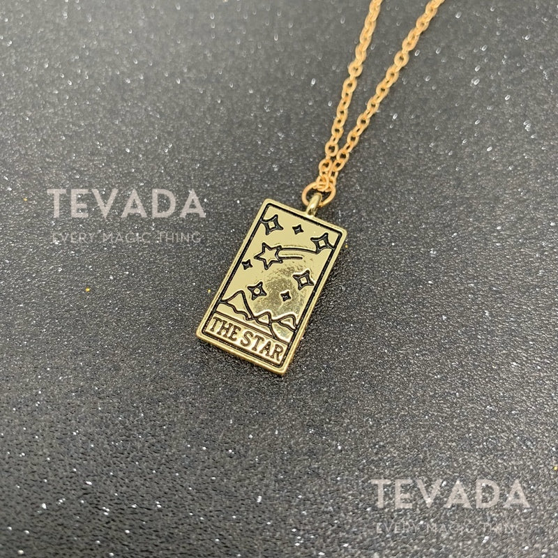 Unlock your intuition with our Tarot Necklace!  Featuring a Sun, Moon, or Star pendant, this handmade necklace is perfect for Wiccan rituals, meditation, and divination. Golden stainless steel chain included. Shop now!