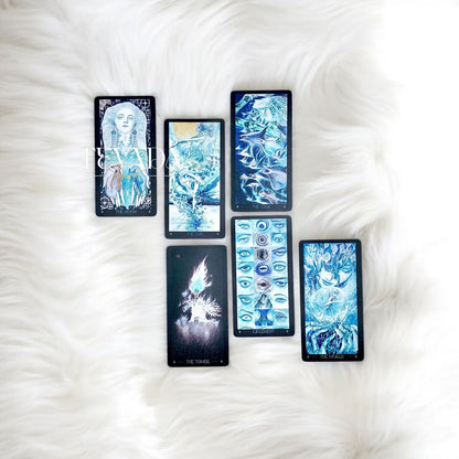 Discover intuitive guidance with the Lighthouse in Fog Tarot Pocket. A magical 78-card deck in black and blue hues, blending ancient legends and dreamlike imagery for profound divination.