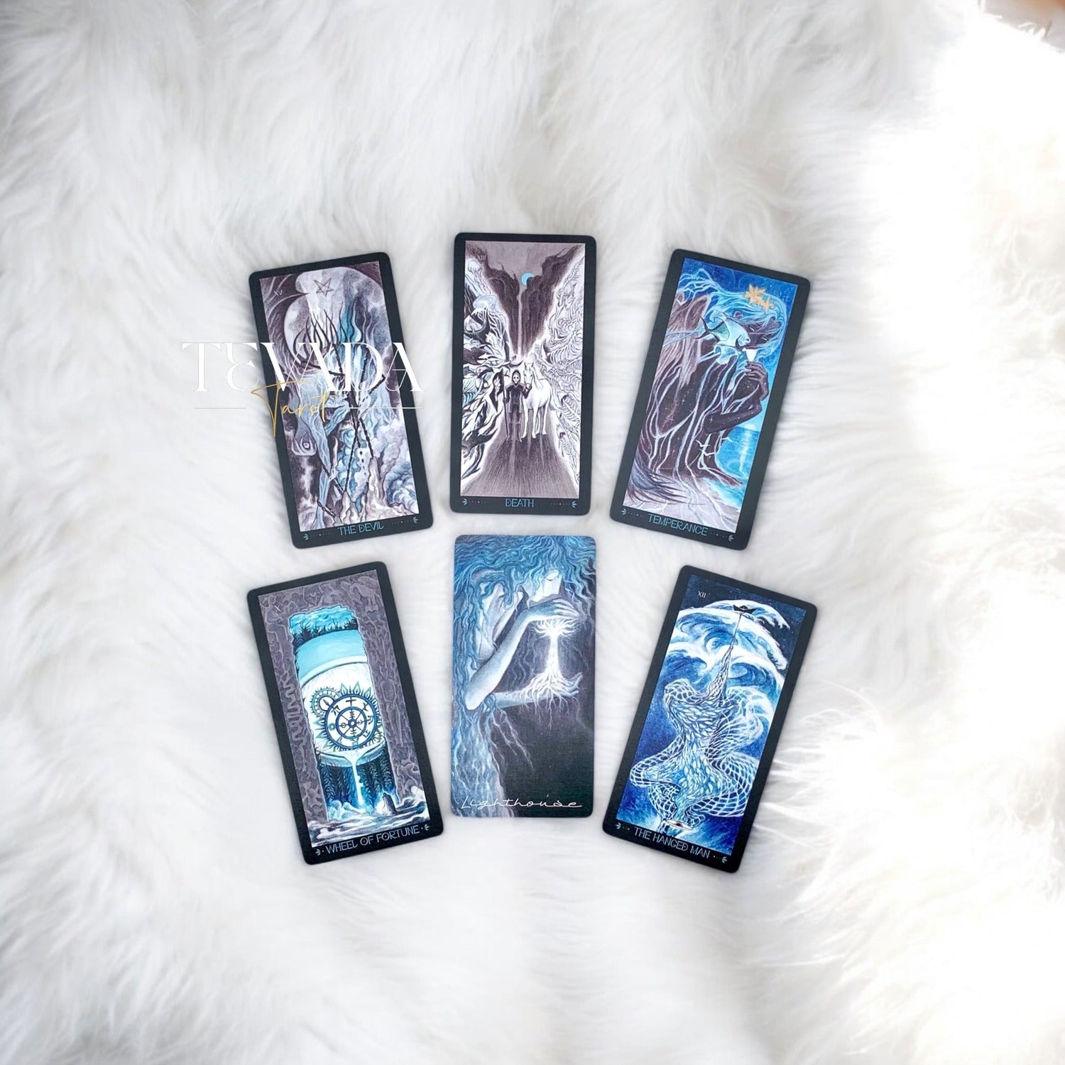 Discover intuitive guidance with the Lighthouse in Fog Tarot Pocket. A magical 78-card deck in black and blue hues, blending ancient legends and dreamlike imagery for profound divination.