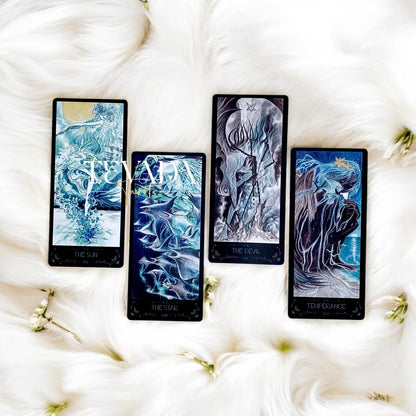 Discover the intuitive magic of The Lighthouse in Fog Tarot, a 78-card deck featuring stunning black and blue designs inspired by mystical ocean tales and ancient legends. Perfect for seekers of wisdom and clarity.