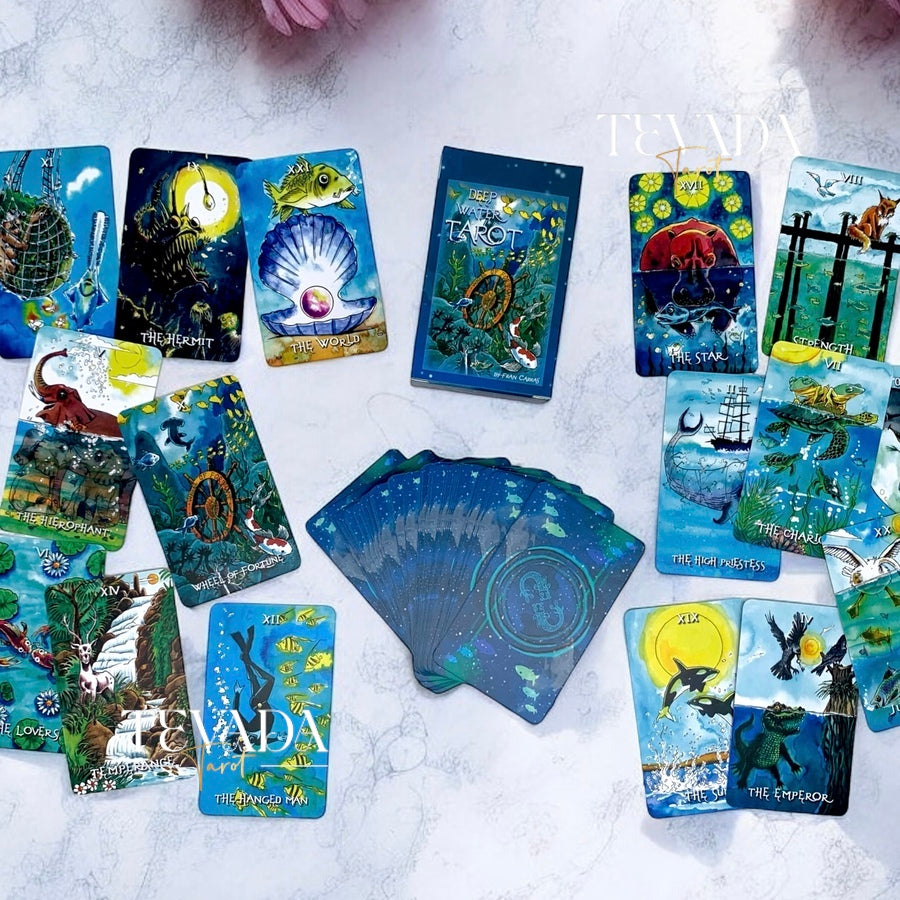 Unveil the magic of the Deep Water Tarot. This 78-card deck in vibrant watercolors guides you on an intuitive journey, revealing wisdom and clarity from mystical underwater creatures.