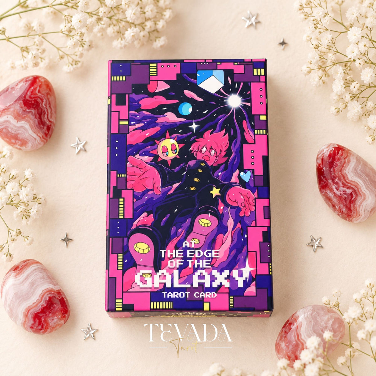 At the Edge of the Galaxy Tarot rigid box with vivid purple and pink cyberpunk artwork on a floral background.