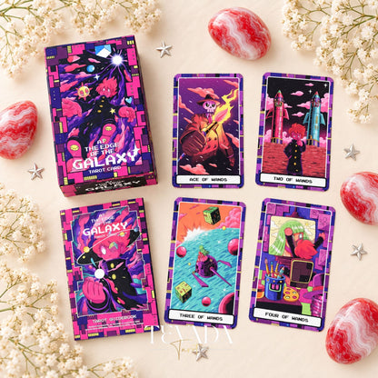 At the Edge of the Galaxy Tarot box and guidebook beside neon illustrated tarot card fronts on a pale floral background.