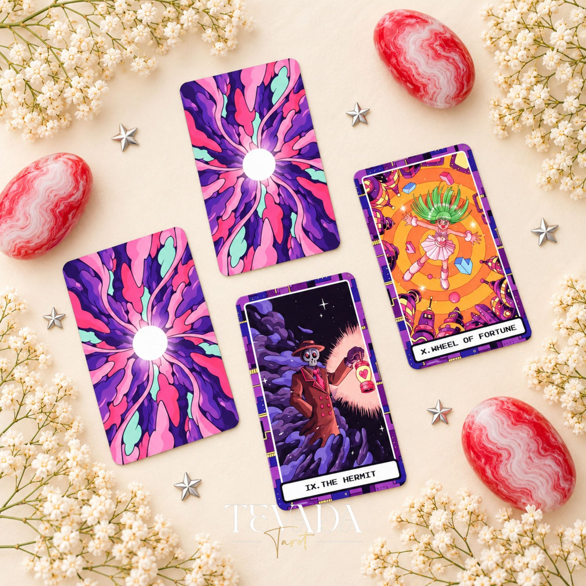 At the Edge of the Galaxy Tarot card backs beside The Hermit and Wheel of Fortune in vivid purple, pink and turquoise.