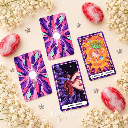 At the Edge of the Galaxy Tarot card backs beside The Hermit and Wheel of Fortune in vivid purple, pink and turquoise.