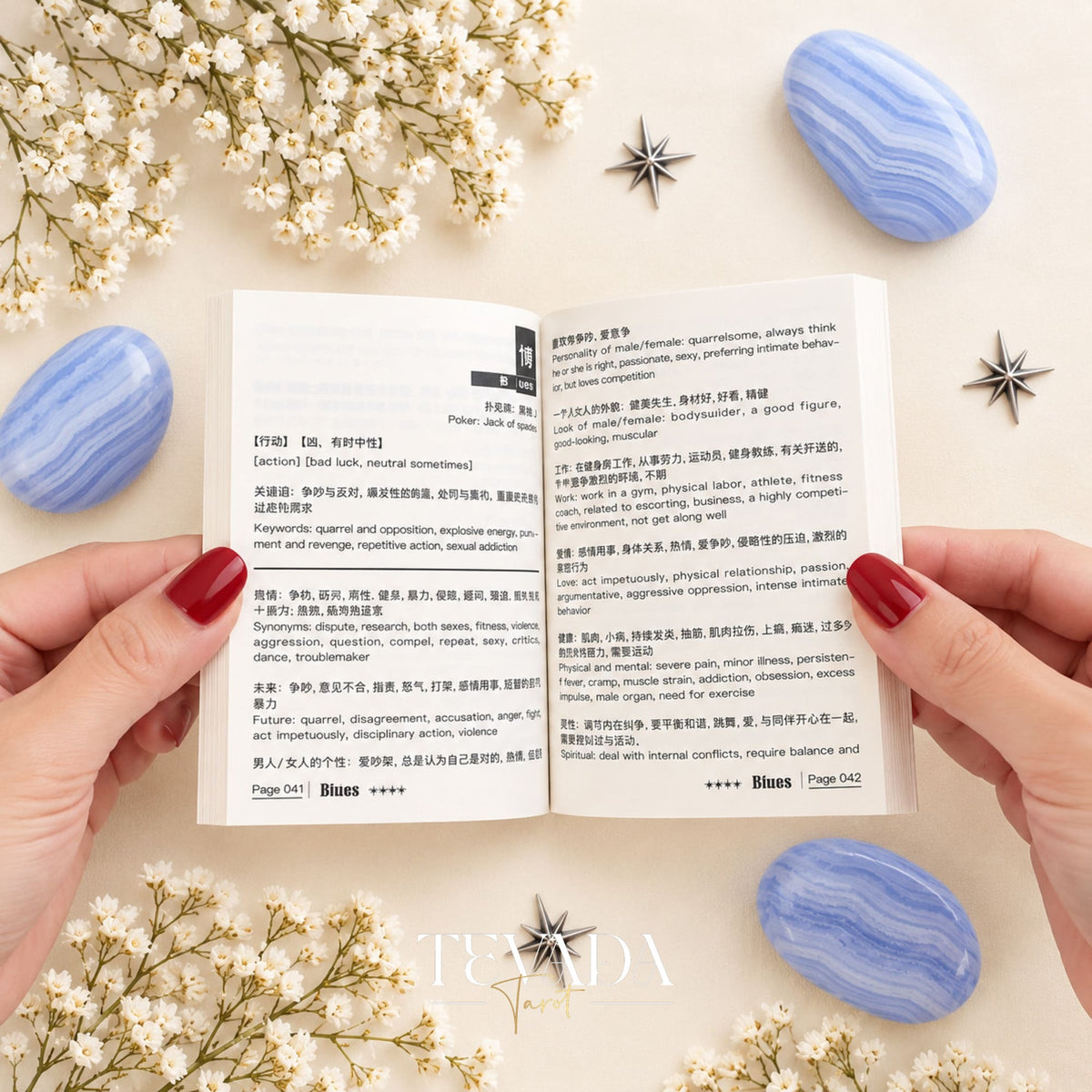 The Blues Lenormand rigid box with blue-and-white bird artwork, styled with blue agate stones, star accents and white blossoms.