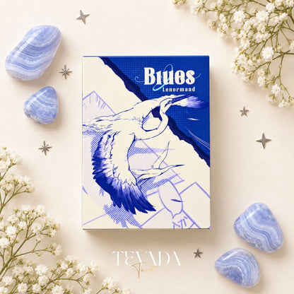 Blue Lenormand cards with star-pattern backs and symbolic illustrations, including a bear, arranged among blue stones and white flowers.