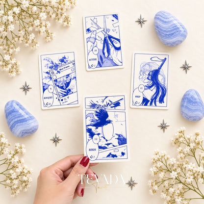 The Blues Lenormand packaging opened to show the blue deck box and cards against a pale background with blue stones.