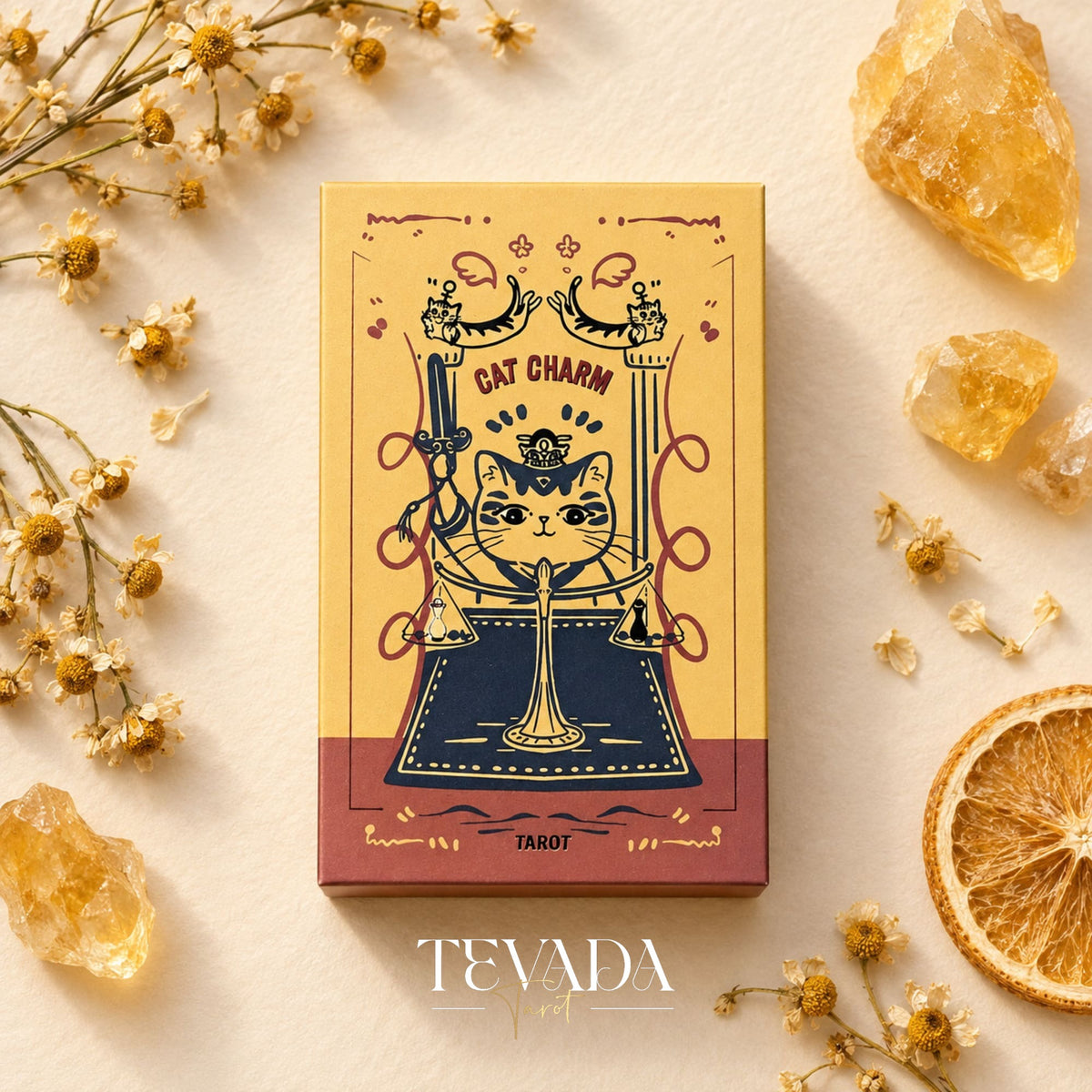 Cat Charm Tarot cards and box in a playful vintage-orange display featuring charming cat characters and talisman-inspired artwork.