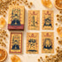 Cat Charm Tarot Deck box with orange vintage cat-themed tarot cards arranged on a warm cream background.