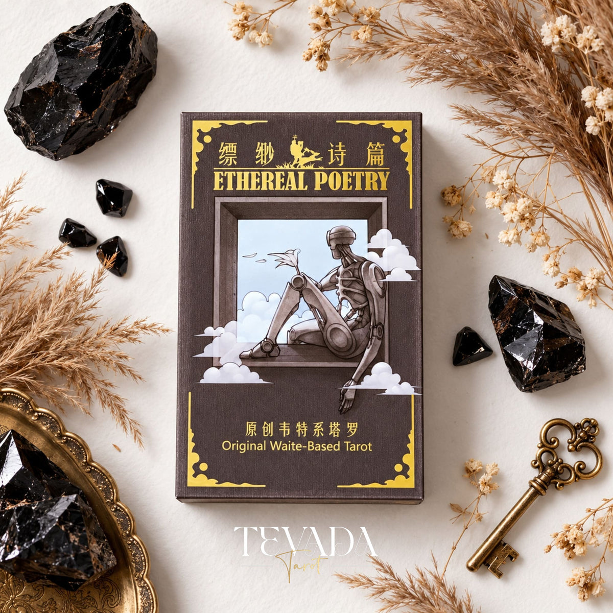 Ethereal Poetry Tarot Deluxe brown box with gold lettering and a seated figure illustration among black crystals and dried grasses.