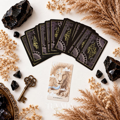 Ethereal Poetry Tarot Deluxe dark ornamental card backs fanned above a sepia illustrated tarot card.