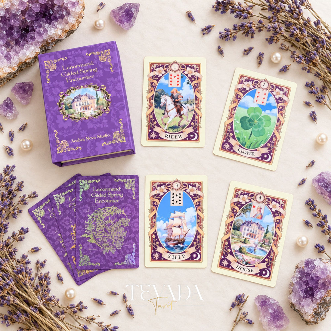 Gilded Spring Encounter Lenormand box with Rider, Clover, Ship and House cards arranged on an ivory surface with lavender sprigs and amethyst crystals.
