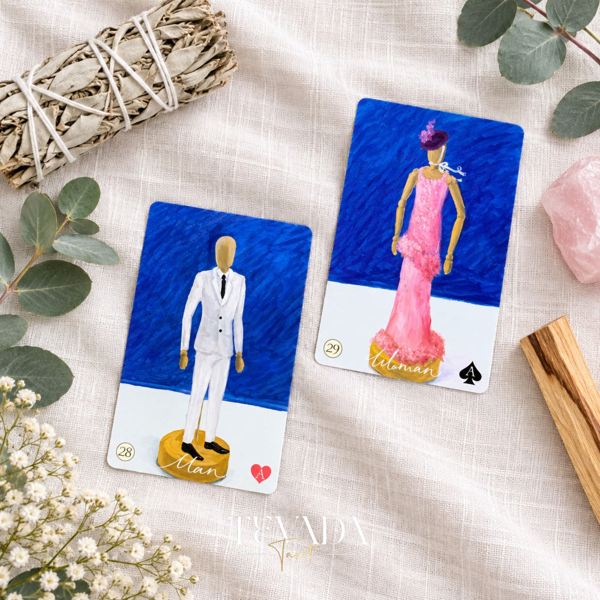 The Stork and Dog Lenormand cards, numbered 17 and 18, displayed in floral frames beside crystals and eucalyptus leaves.