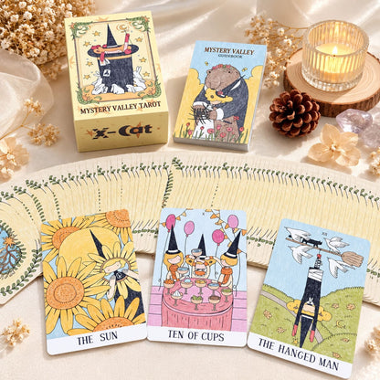 Mystery Valley Tarot DELUXE tarot card artwork with playful witches, storybook forests, and oversized fantasy creatures