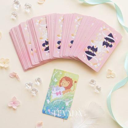 Mystic Meows Tarot PINK Deluxe deck featuring dreamy cat illustrations on premium 330gsm black core cards with blue splatter and silver sparkle edges, in a magnetic flip-top rigid box.