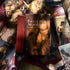 Close-up spread of Pact of the Arcana Tarot cards showing dark romantic male figures, scarlet roses, and silver foil details