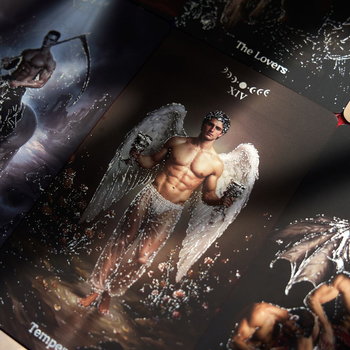 Pact of the Arcana Tarot Lovers card showing a winged male figure among moonlit romantic imagery