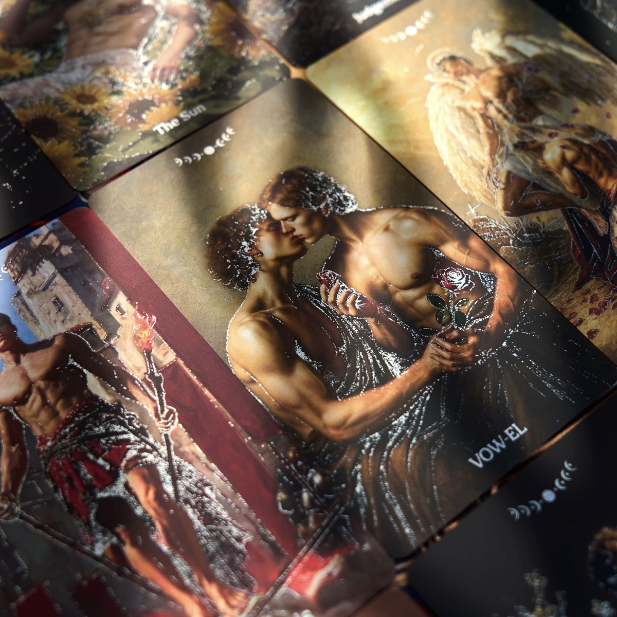 Pact of the Arcana Tarot card spread with dark romantic male figures, scarlet roses, and shimmering silver foil