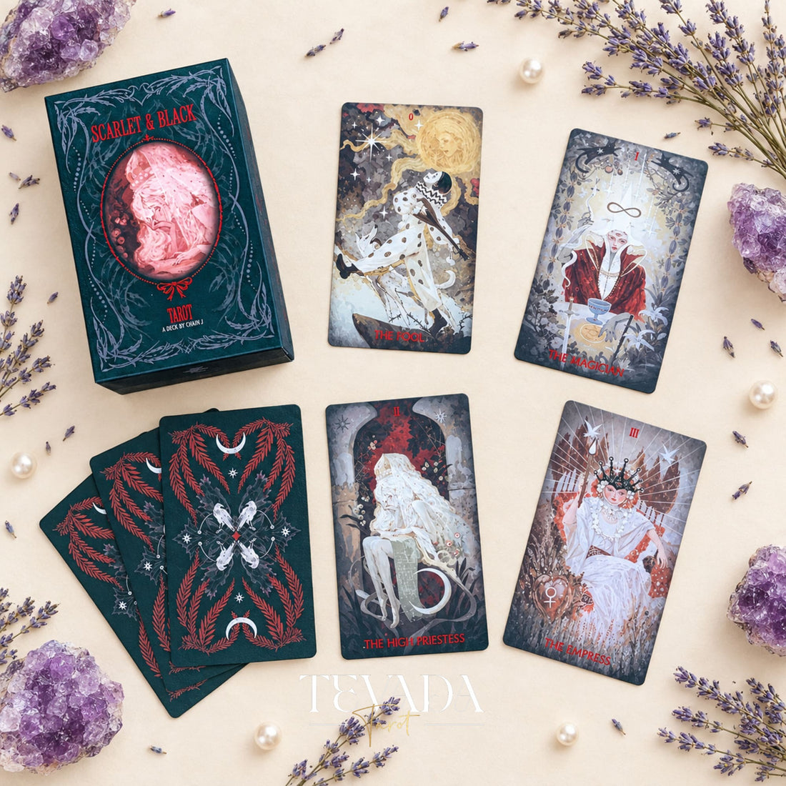 A selection of Scarlet &amp; Black Tarot cards with dramatic red, black and white gothic illustrations, displayed beside the deck box.