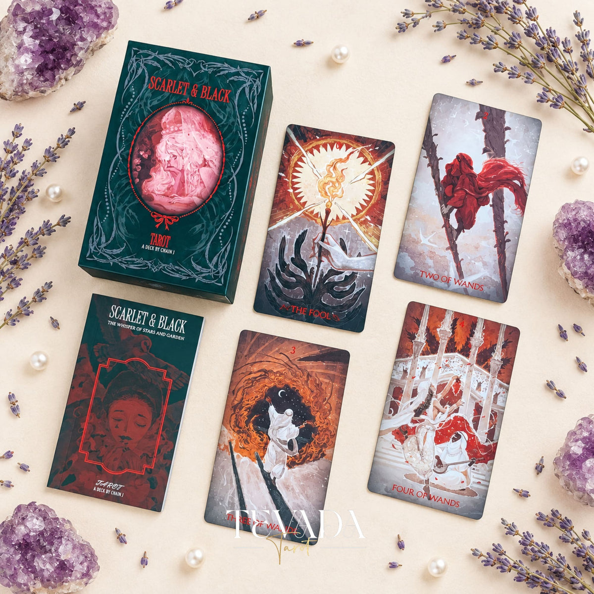 The Scarlet &amp; Black Tarot box shown open with its red interior and matching illustrated deck packaging.