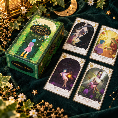 The Hedge Maze Tarot green box with four illustrated cards, white flowers and a golden crescent moon.