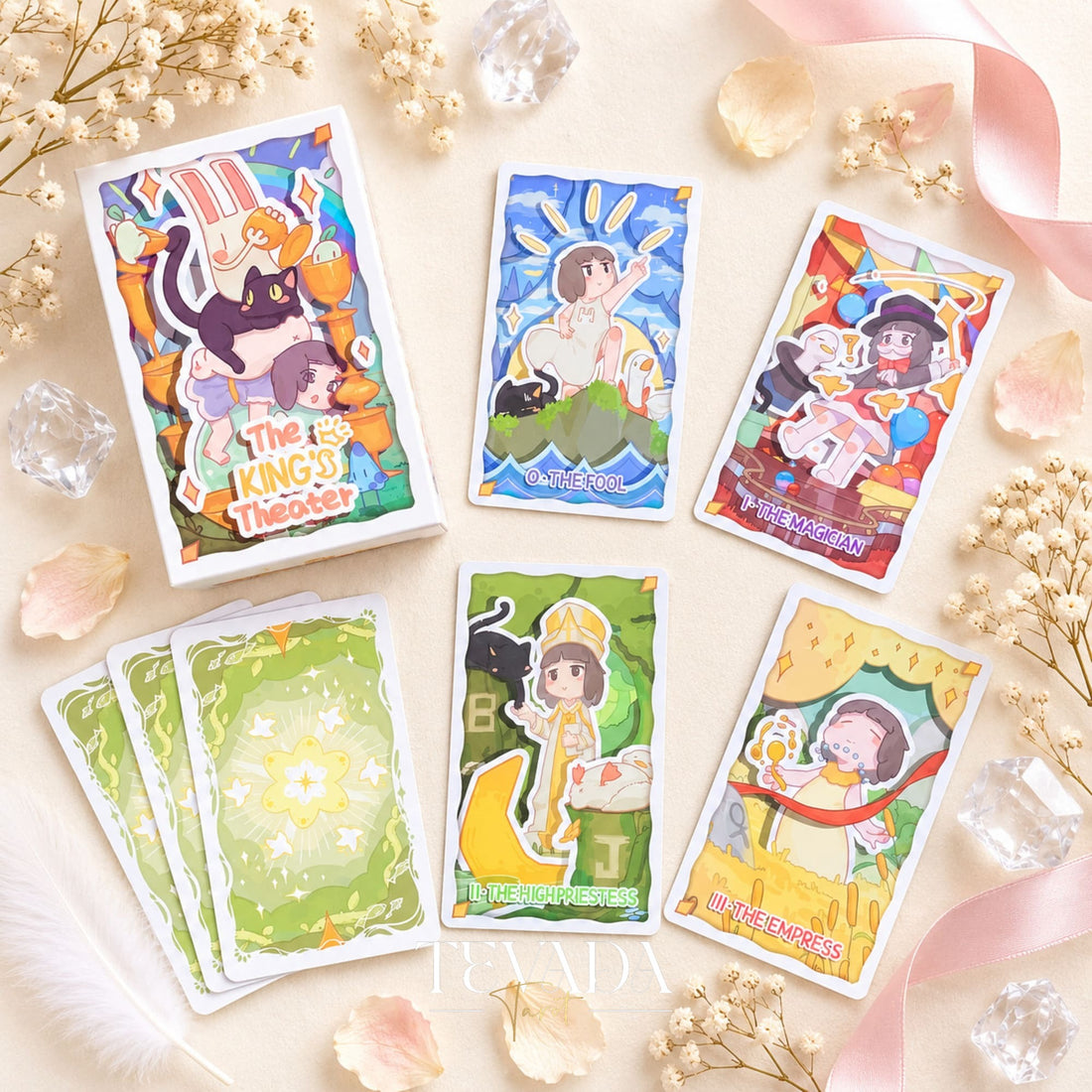 The King Theater Tarot box and deck packaging displayed with a selection of illustrated stage-themed cards.
