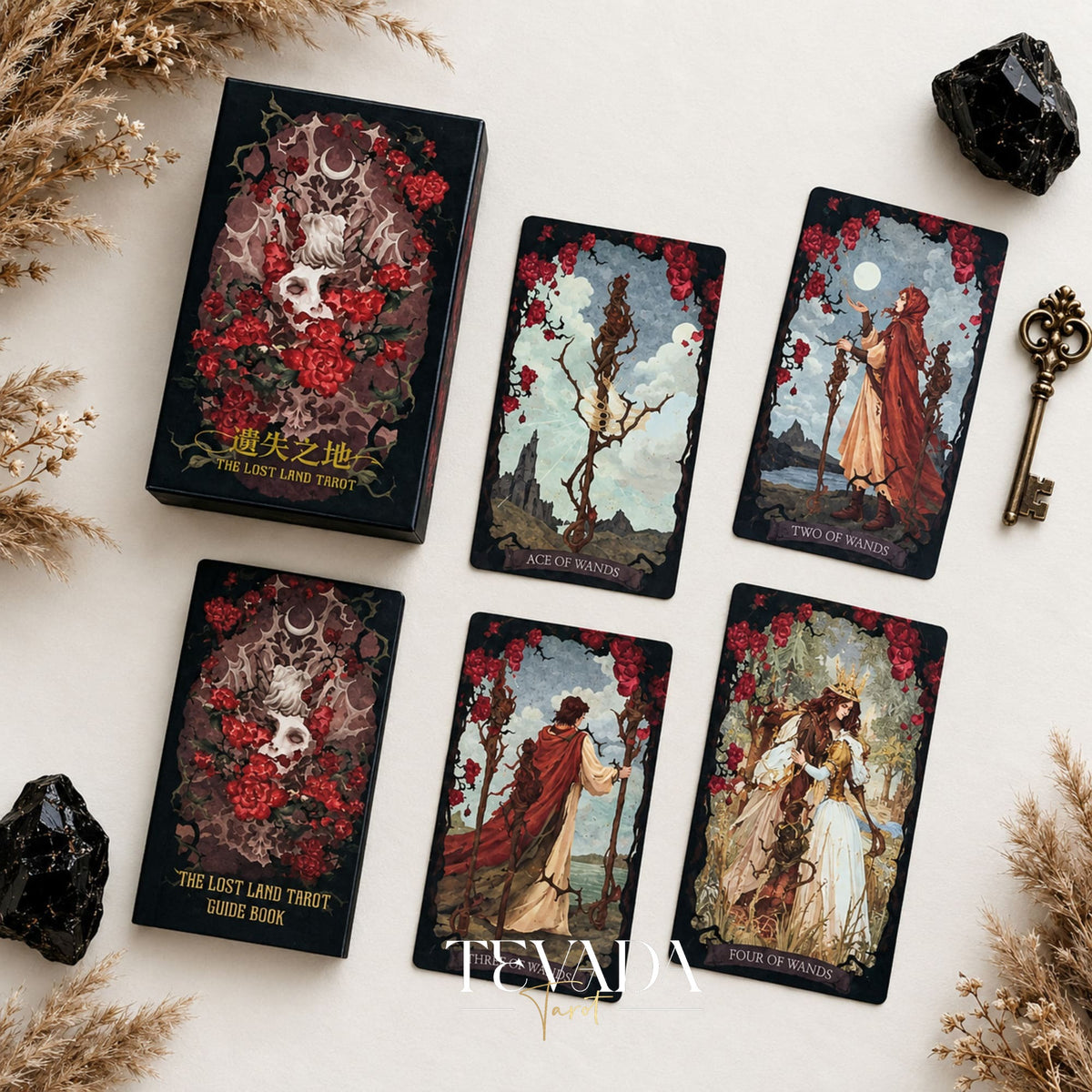 The Lost Land Tarot Fading Edition red-edged deck box with Ace of Wands, Two of Wands, and other dark watercolor tarot cards