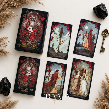 The Lost Land Tarot Fading Edition red-edged deck box with Ace of Wands, Two of Wands, and other dark watercolor tarot cards