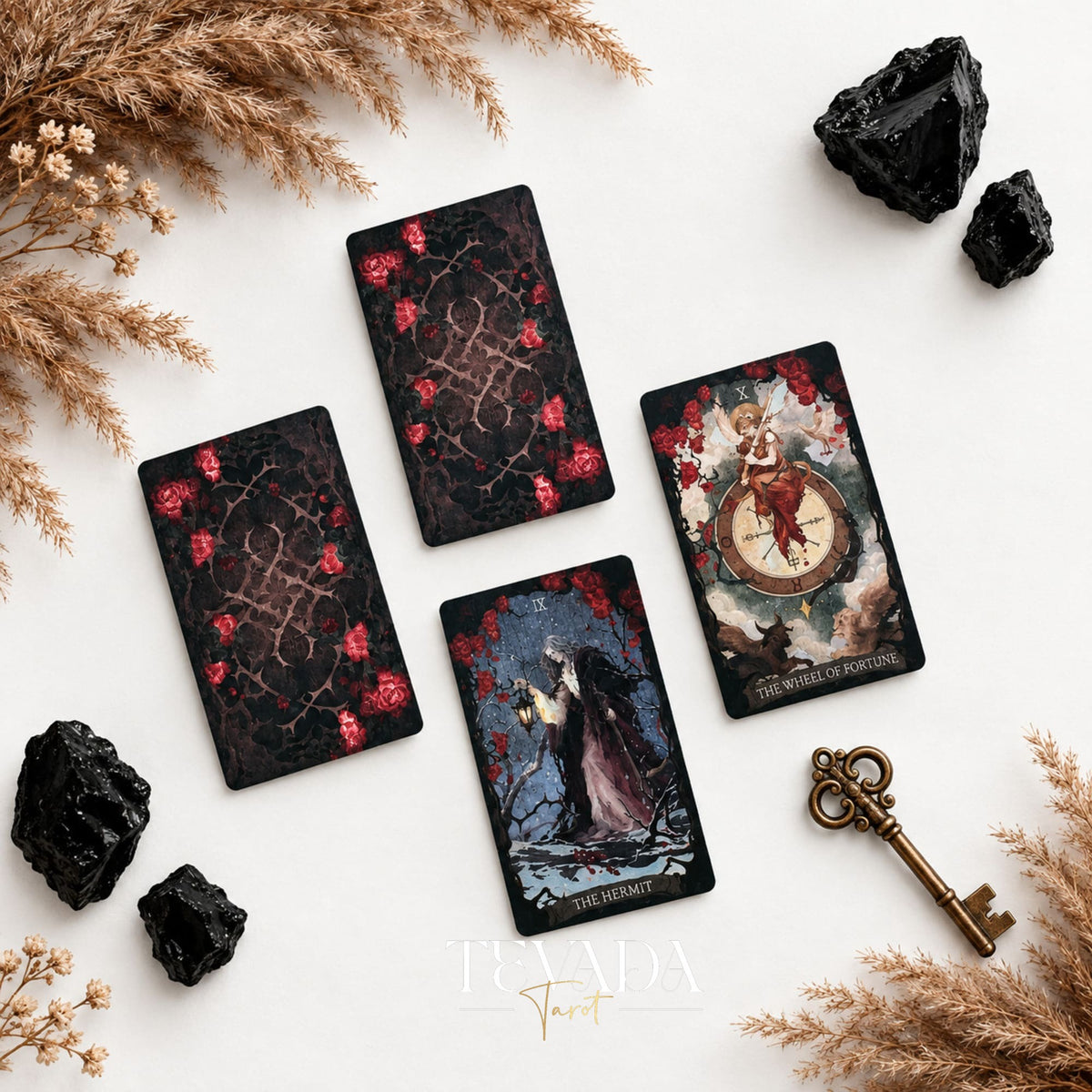 The Lost Land Tarot Fading Edition spread with ornate card backs and face-up dark watercolor tarot cards
