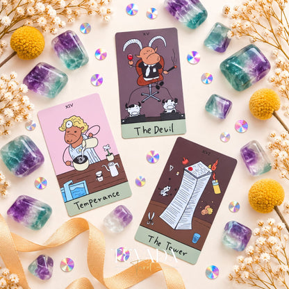 The Office Workhorse Tarot cards fanned beside crystals and flowers, showing humorous workplace-inspired tarot art.